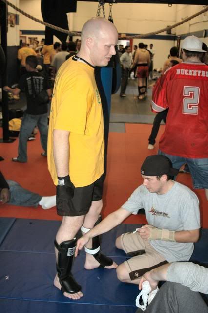 Coach Jason helping John get ready for the fight